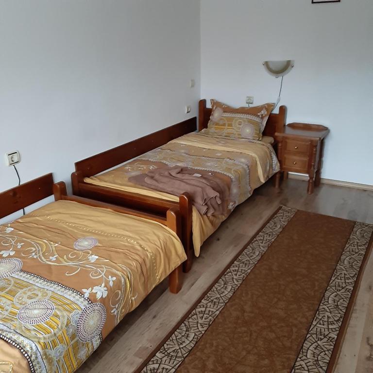 Postel nebo postele na pokoji v ubytování Hadji Georgi Hotel