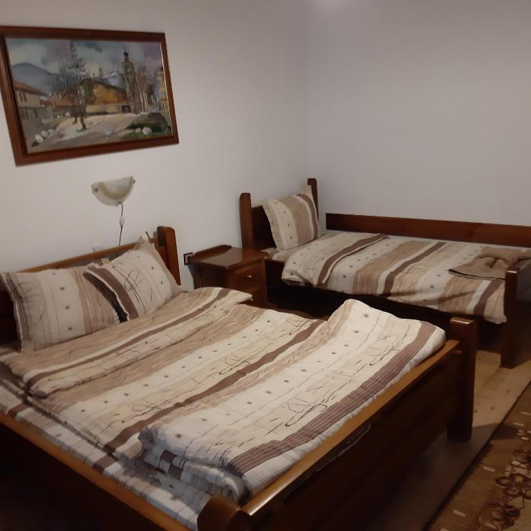 Postel nebo postele na pokoji v ubytování Hadji Georgi Hotel