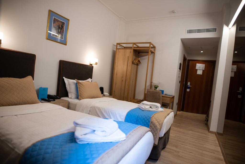 Posteľ alebo postele v izbe v ubytovaní Anastazia Luxury Suites & Spa