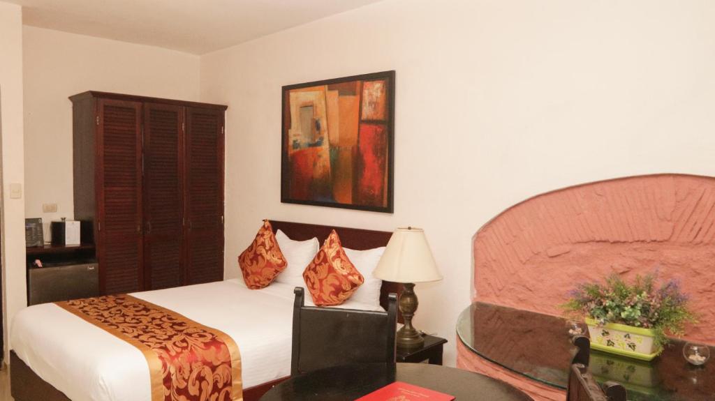 Postel nebo postele na pokoji v ubytování Boutique Hotel Palacio