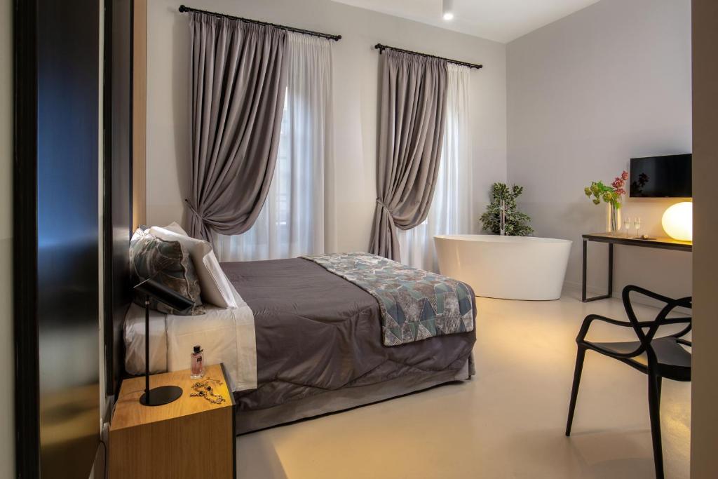Giường trong phòng chung tại Viminale View Hotel