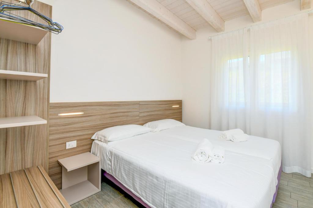 Posteľ alebo postele v izbe v ubytovaní Relais Rosa Dei Venti -Ciao Vacanze-