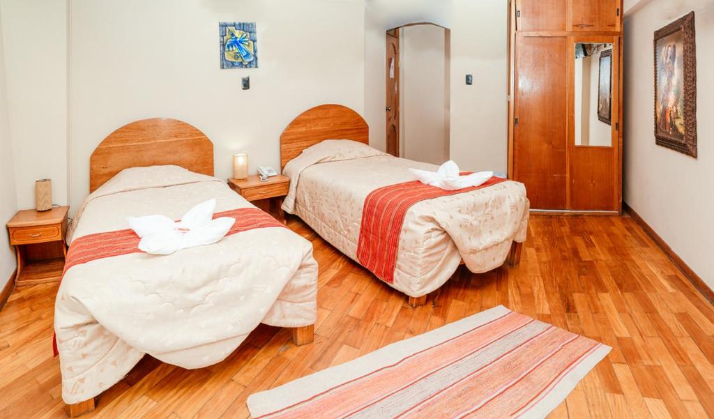 Postel nebo postele na pokoji v ubytování Hotel Melanys