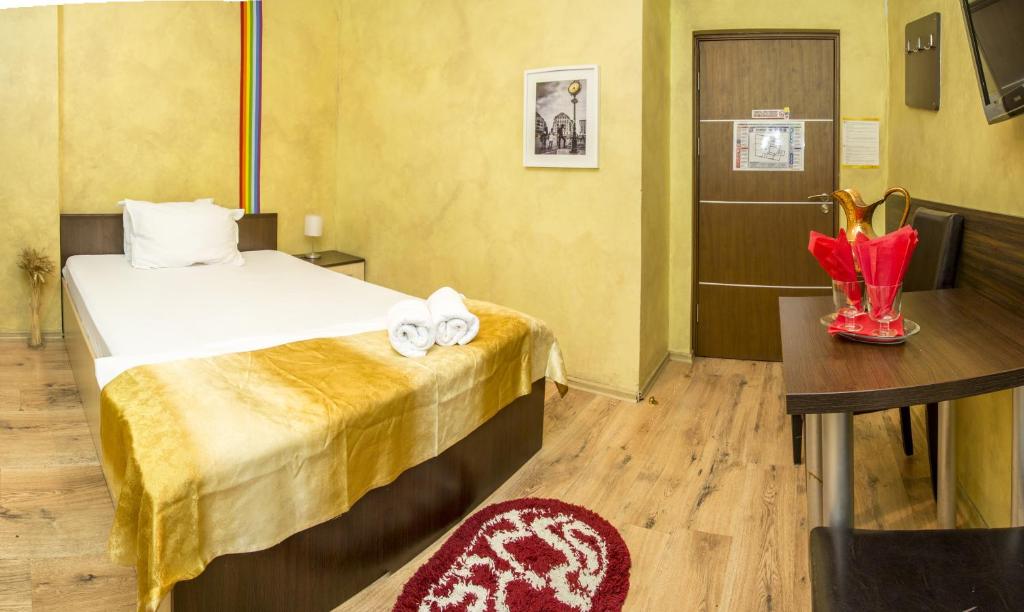 Postel nebo postele na pokoji v ubytování Hotel EOS