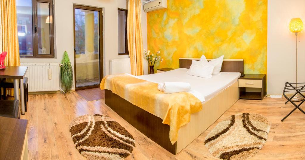 Postel nebo postele na pokoji v ubytování Hotel EOS