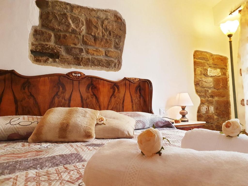 a bedroom with a bed with two stuffed animals on it at RistoriApartment in Florence