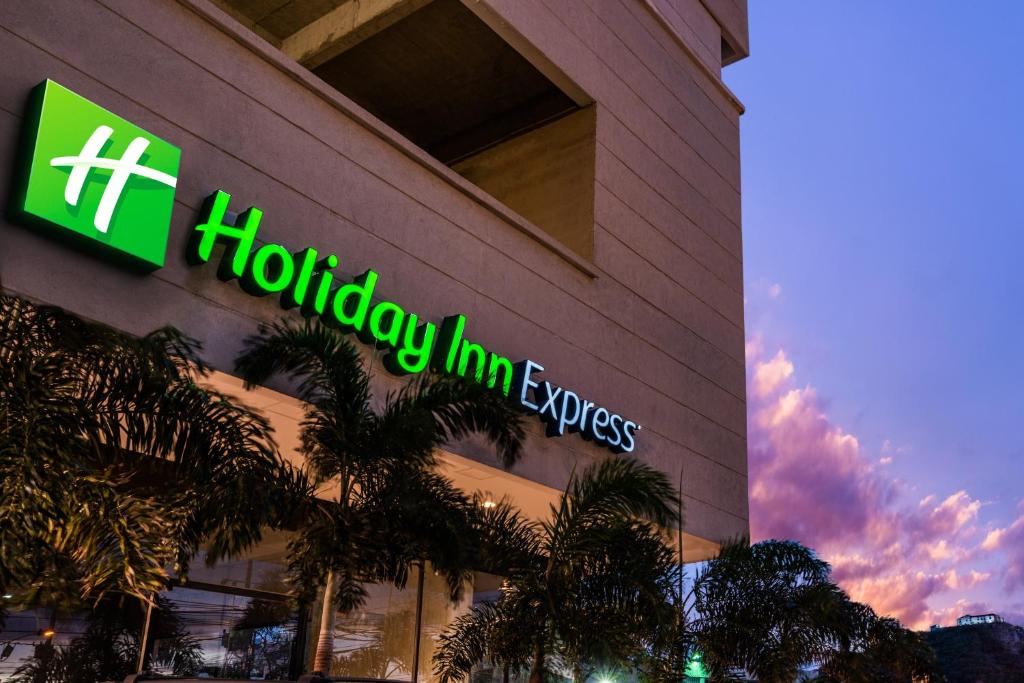 a holiday inn express sign on the side of a building at Holiday Inn Express Cartagena Manga, an IHG Hotel in Cartagena de Indias