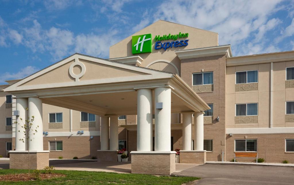 a hotel with a sign on top of a building at Holiday Inn Express Devils Lake, an IHG Hotel in Devils Lake