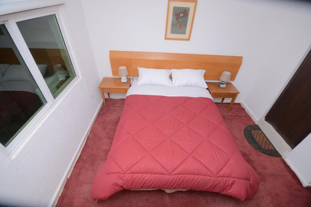 Postel nebo postele na pokoji v ubytování Petra Lion Hotel