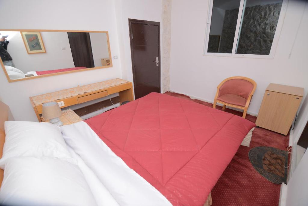Postel nebo postele na pokoji v ubytování Petra Lion Hotel