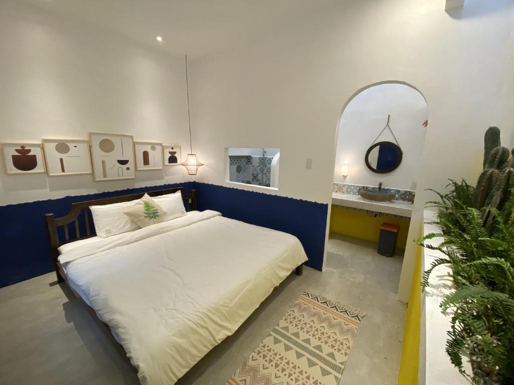 Postel nebo postele na pokoji v ubytování Hacoda Homestay