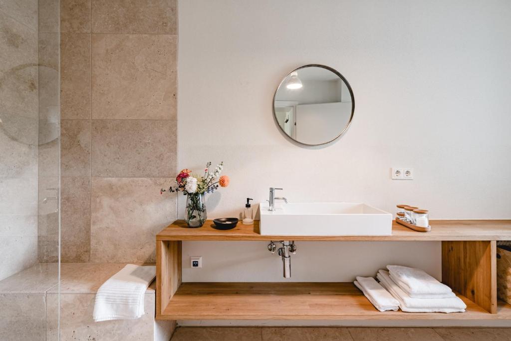 a bathroom with a sink and a mirror at Haizing 26 in Haizing