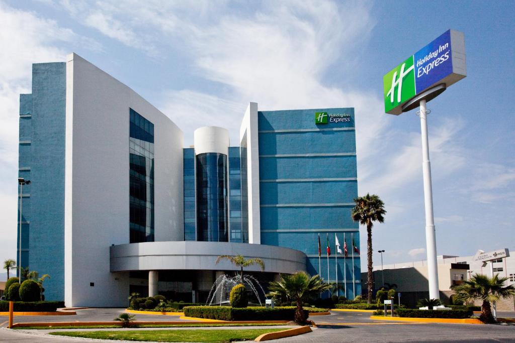 a large building with a sign in front of it at Holiday Inn Express San Luis Potosí, an IHG Hotel in San Luis Potosí
