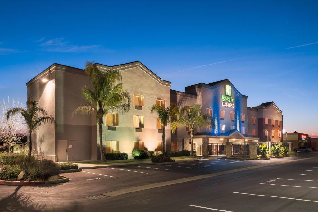 a rendering of a hotel with a parking lot at Holiday Inn Express Rocklin - Galleria Area, an IHG Hotel in Rocklin