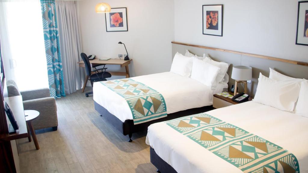 Postel nebo postele na pokoji v ubytování Holiday Inn Suva by IHG