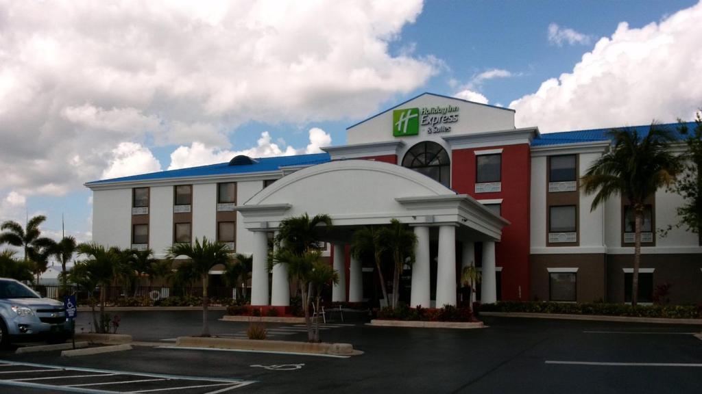 a large building with a sign on the side of it at Holiday Inn Express Lake Okeechobee, an IHG Hotel in Okeechobee