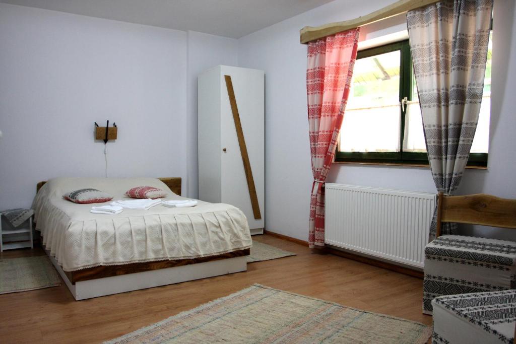 Postel nebo postele na pokoji v ubytování Hanul Kassay