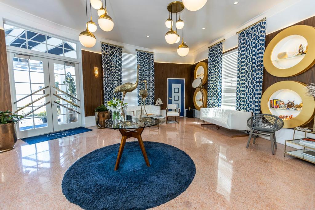 a living room with a table and a couch at Oceanside Hotel and Suites in Miami Beach