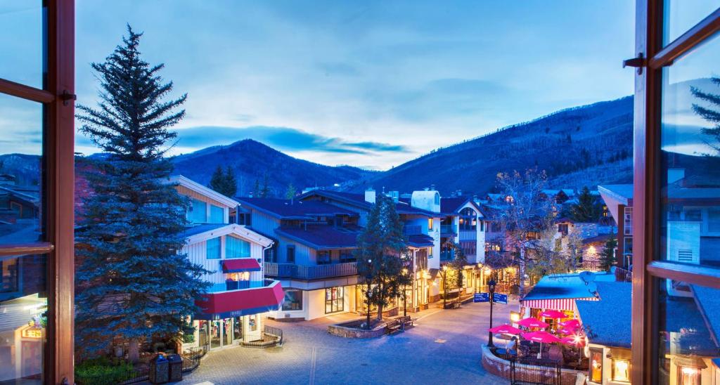 a view from a window of a town with a christmas tree at Christiania Condominiums- CoralTree Residence Collection in Vail