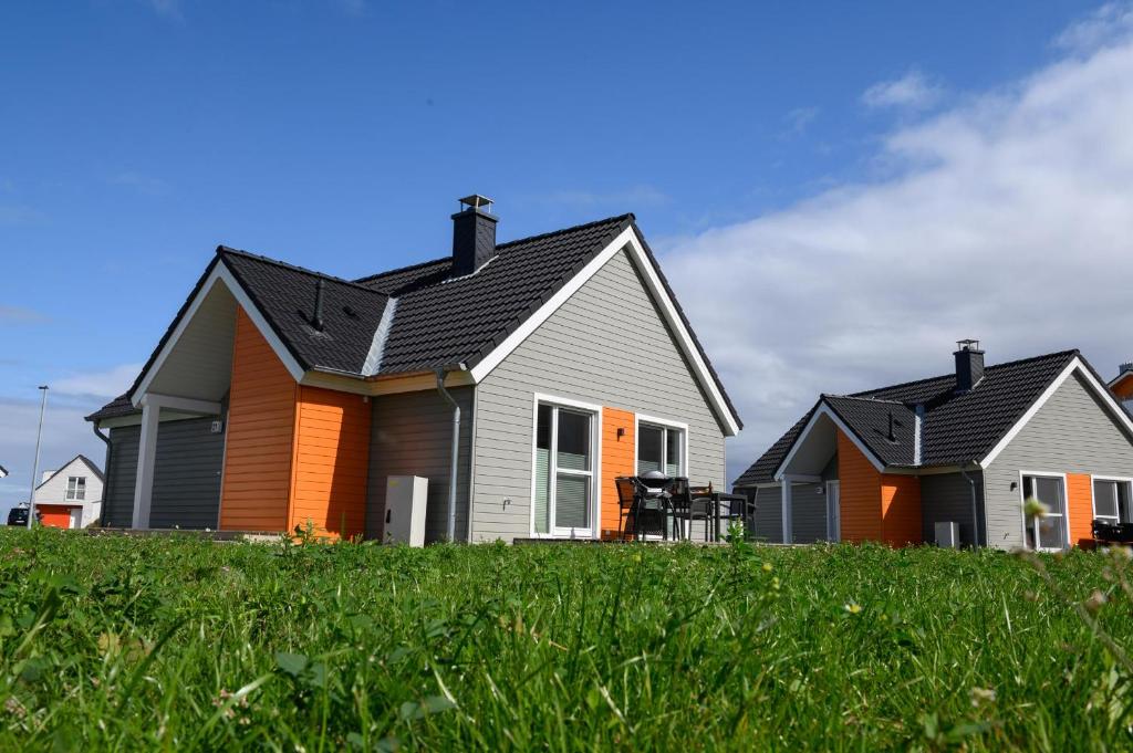 a house with grey and orange at Frische Brise in Olpenitz