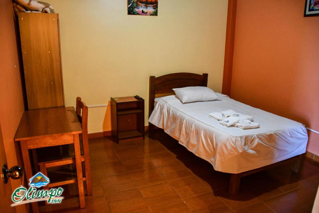 Postel nebo postele na pokoji v ubytování Olimpo Inn