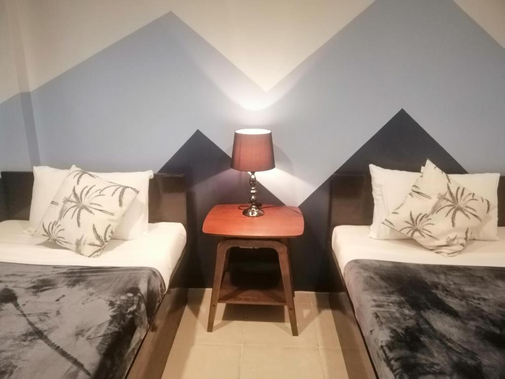 Postel nebo postele na pokoji v ubytování Coron Ecolodge