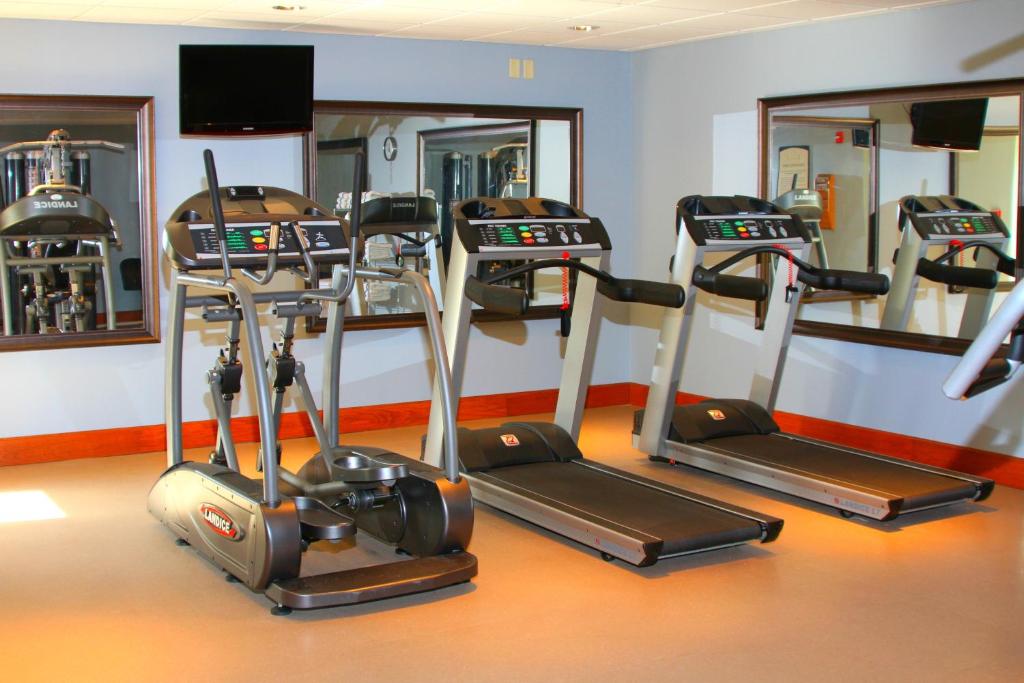 a gym with three tread machines in a room at Staybridge Suites Syracuse Liverpool, an IHG Hotel in Liverpool