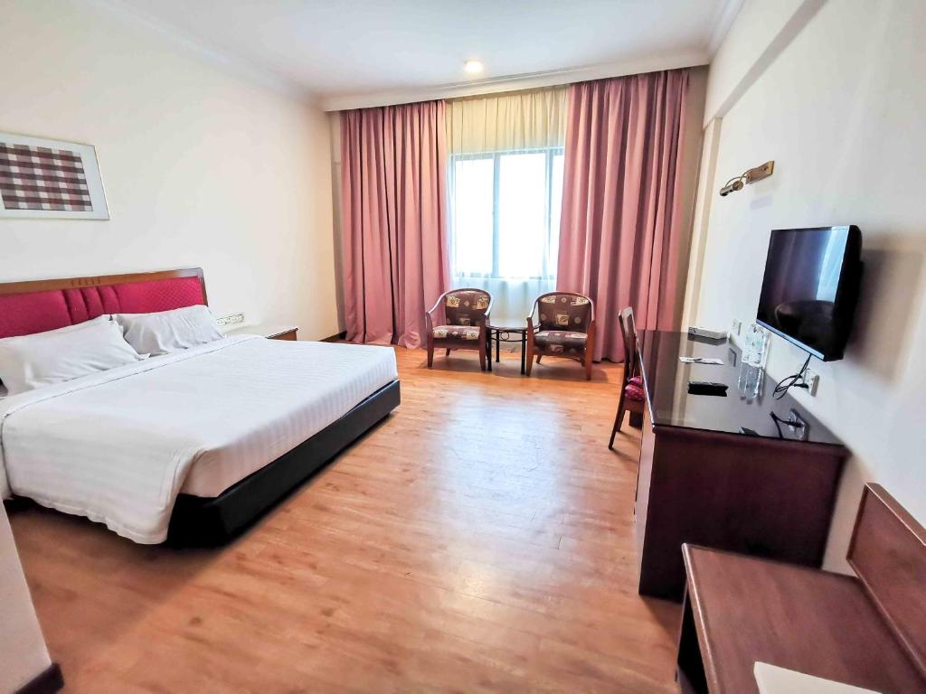 Postel nebo postele na pokoji v ubytování Crystal Crown Hotel Harbour View, Port Klang