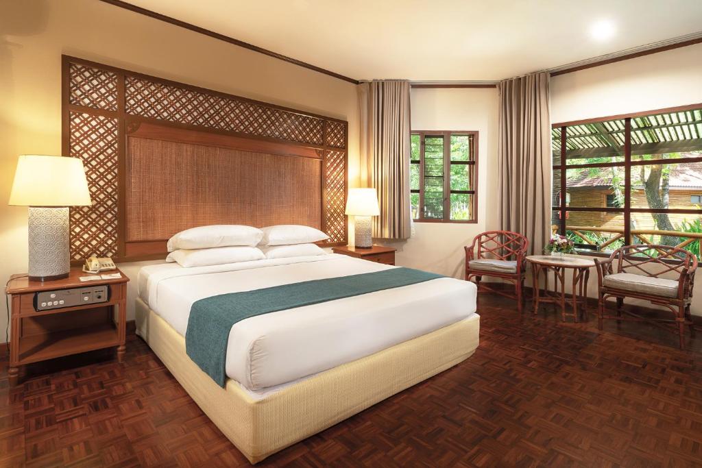 Rúm í herbergi á Regent - Chalet, Hua Hin