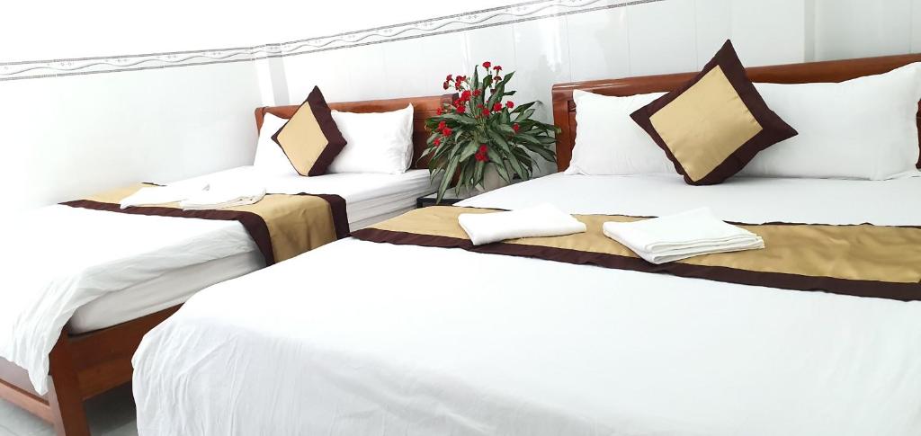 Tai Tri Guest House tesisinde bir odada yatak veya yataklar