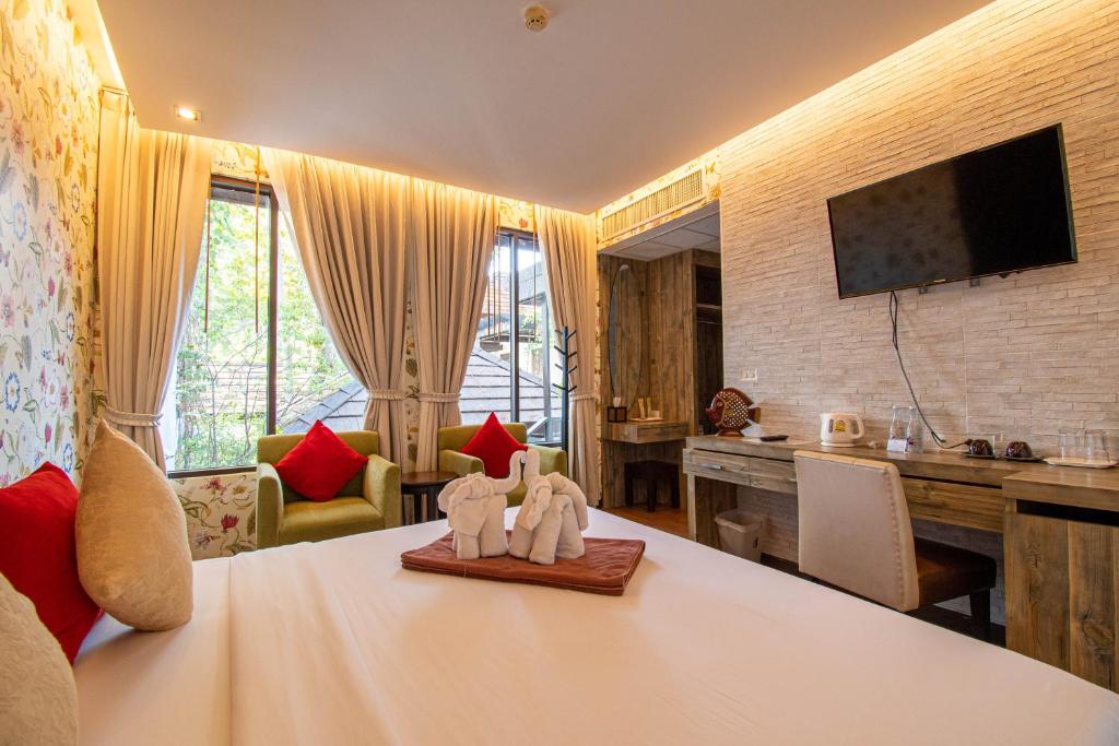 Postel nebo postele na pokoji v ubytování Samed Pavilion Resort