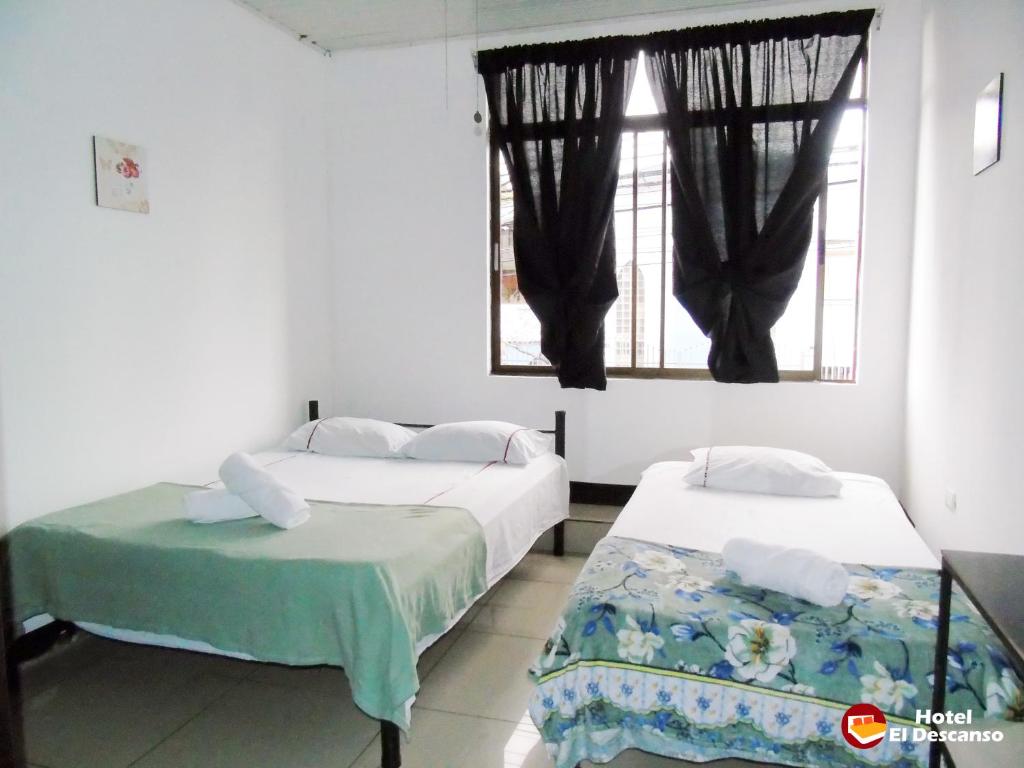 Postel nebo postele na pokoji v ubytování Hotel El Descanso