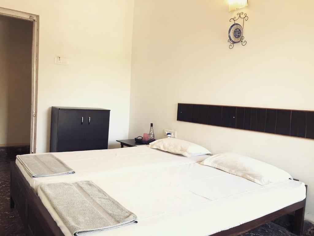 Postel nebo postele na pokoji v ubytování Hotel Paulino