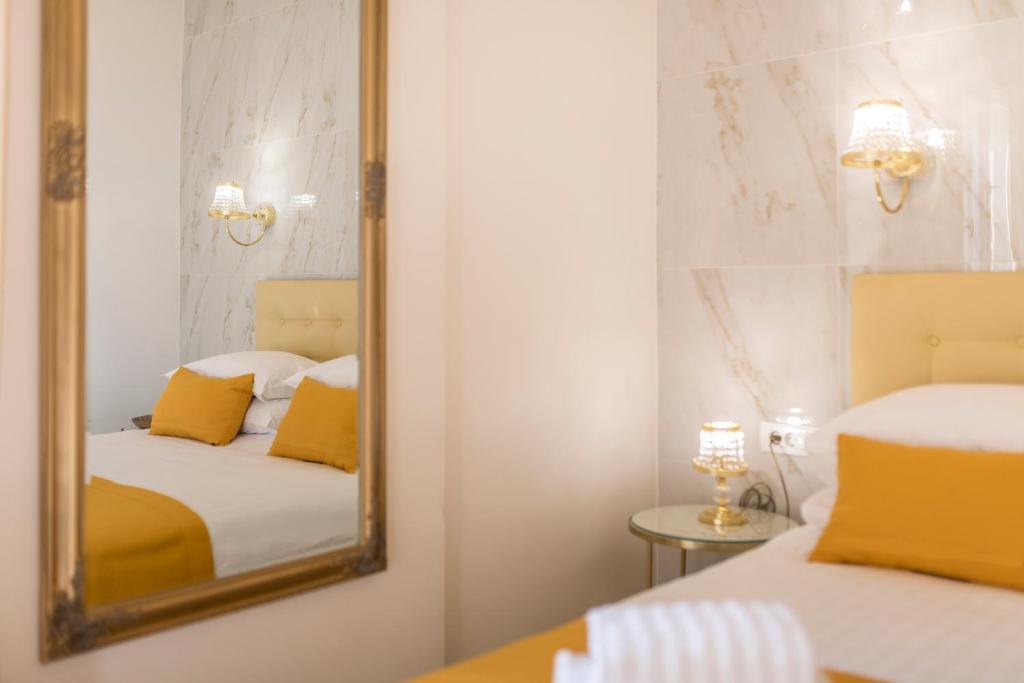Postel nebo postele na pokoji v ubytování Olivia Luxury Rooms