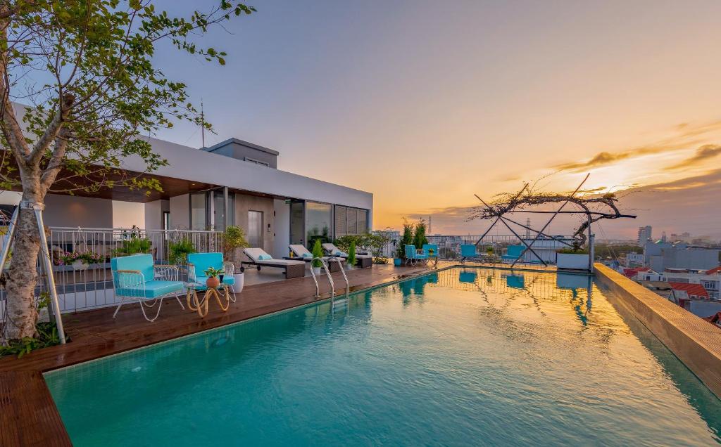a pool on the roof of a house at Prana Boutique Hotel and Apartments in Da Nang