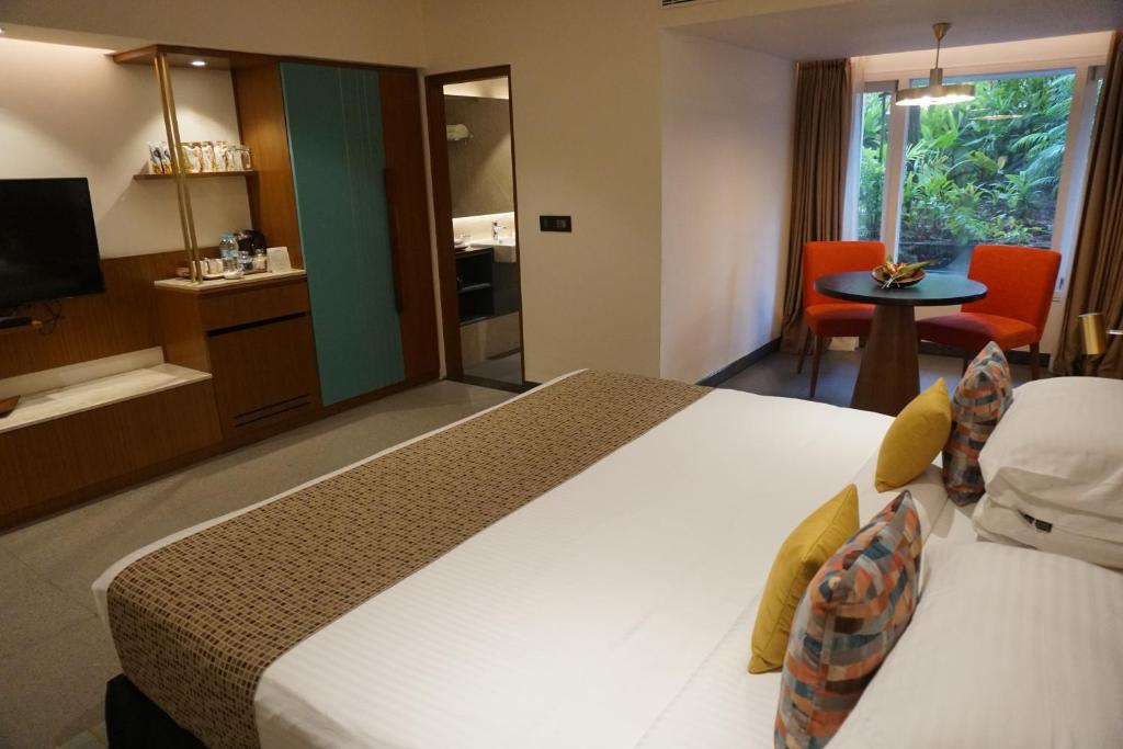 Postel nebo postele na pokoji v ubytování Casino Hotel - CGH Earth, Cochin