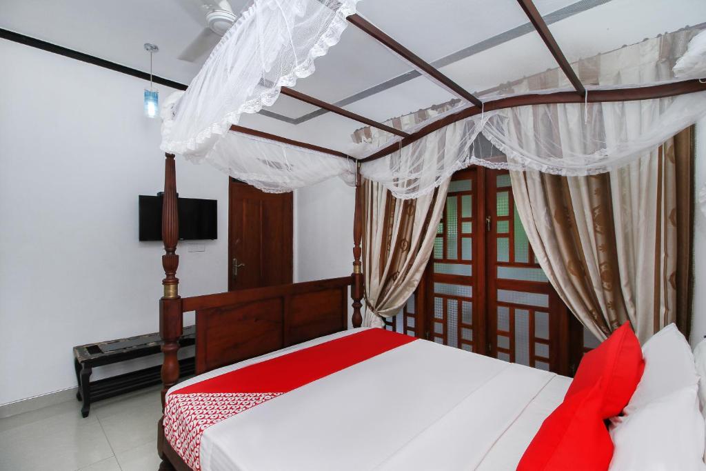 Postel nebo postele na pokoji v ubytování New Okay Hotel