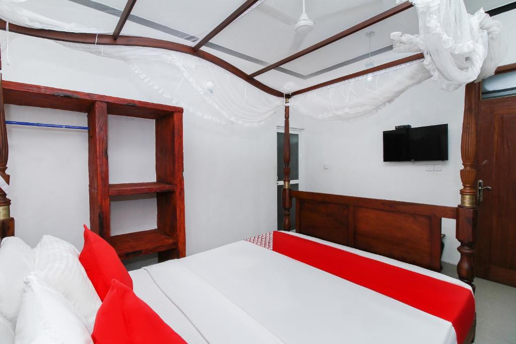 Postel nebo postele na pokoji v ubytování New Okay Hotel