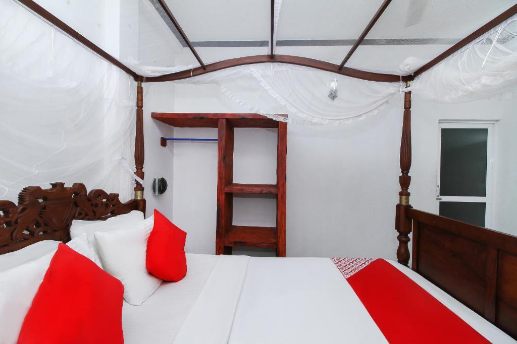 Postel nebo postele na pokoji v ubytování New Okay Hotel