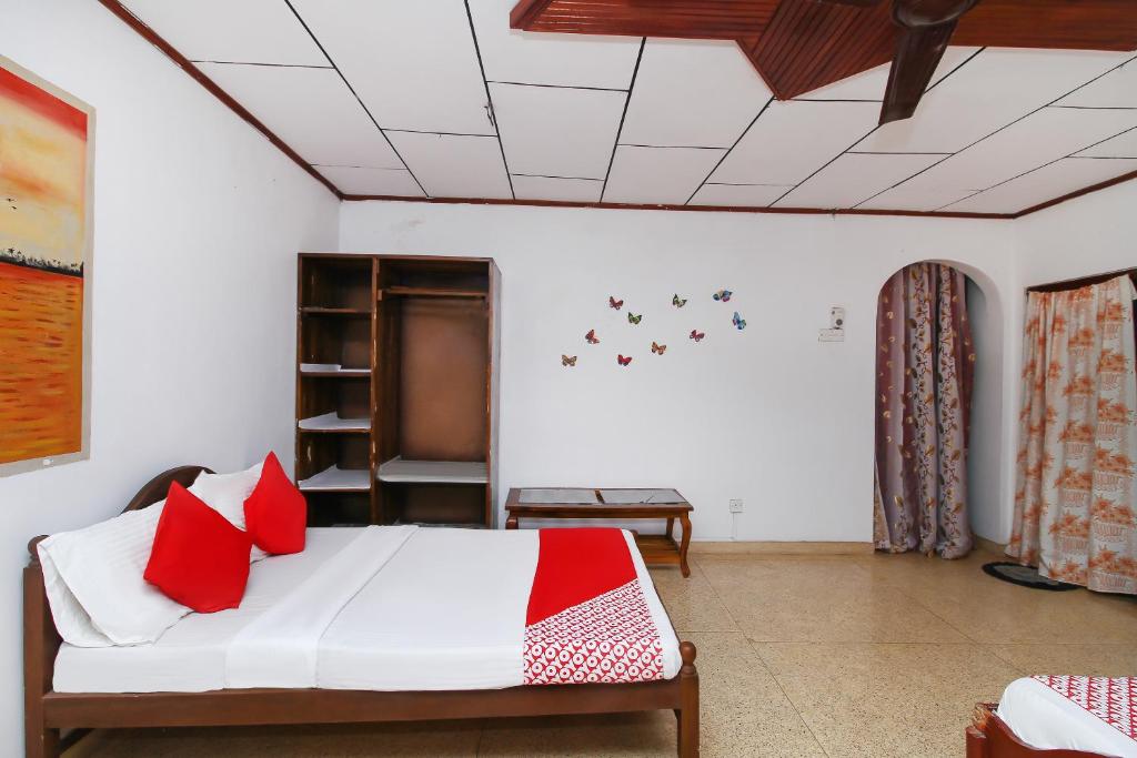 Postel nebo postele na pokoji v ubytování New Okay Hotel