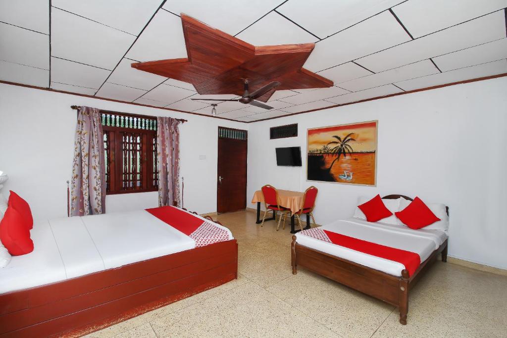 Postel nebo postele na pokoji v ubytování New Okay Hotel