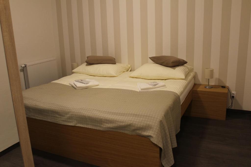 Łóżko lub łóżka w pokoju w obiekcie Apartments 461