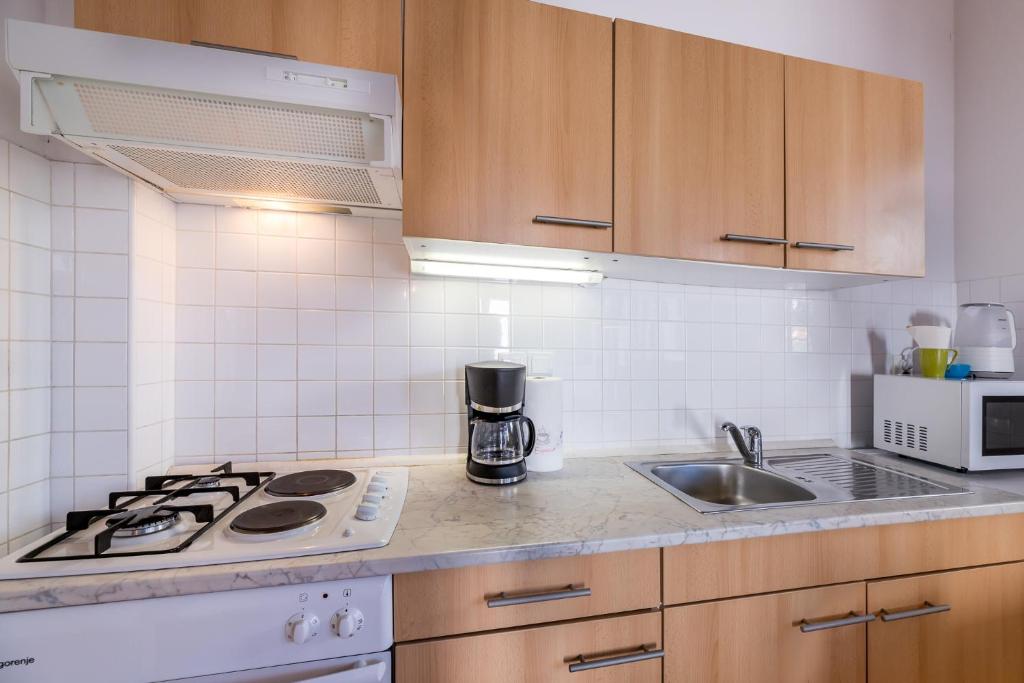 Kuchyňa alebo kuchynka v ubytovaní Apartment Alan