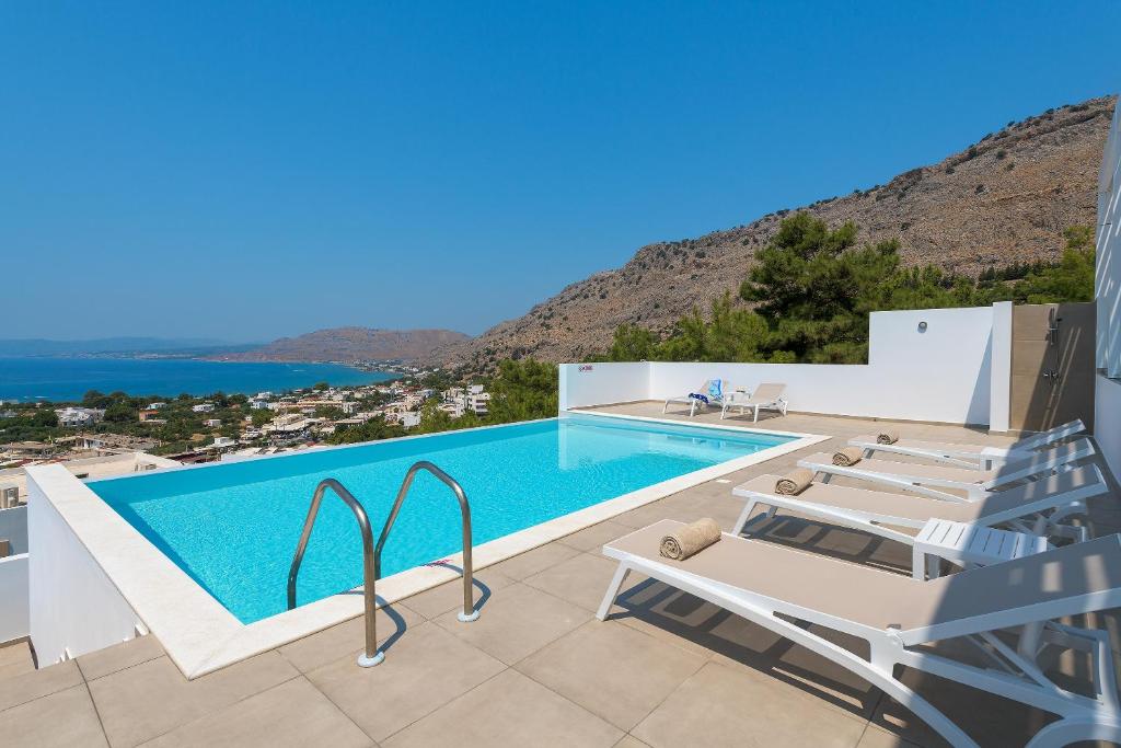 a villa with a swimming pool with a view at Villa Allegra with pool in Pefkos, Lindos area in Pefki Rhodes