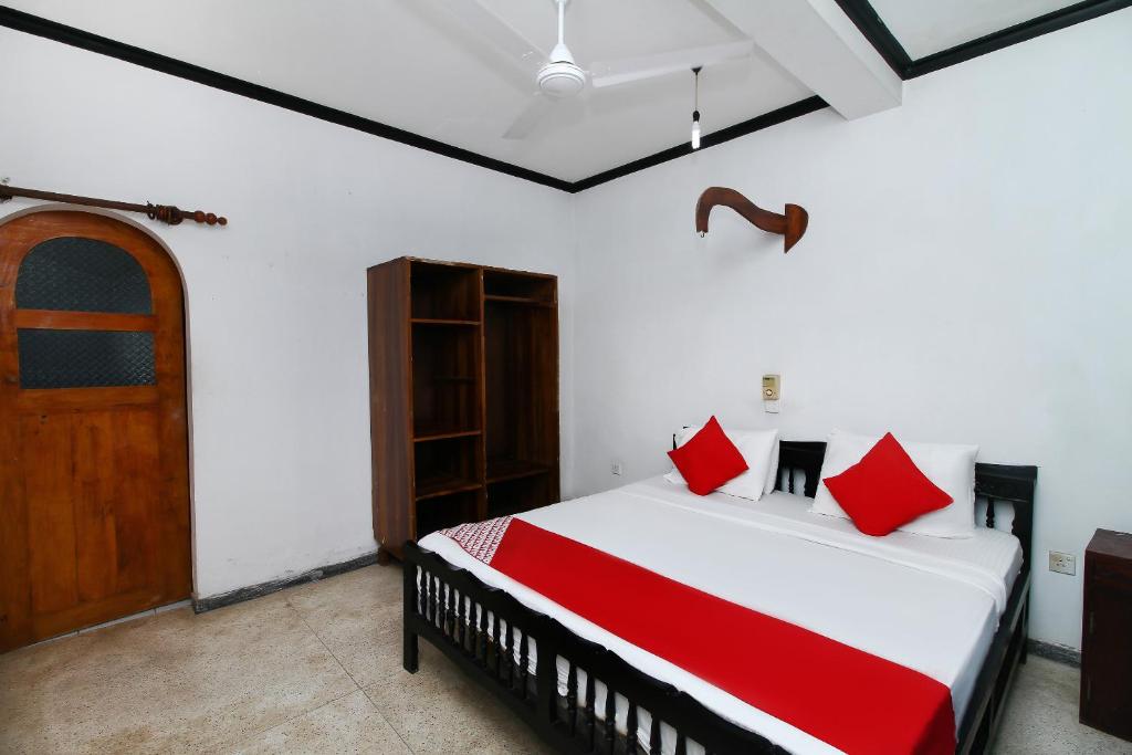 Postel nebo postele na pokoji v ubytování New Okay Hotel
