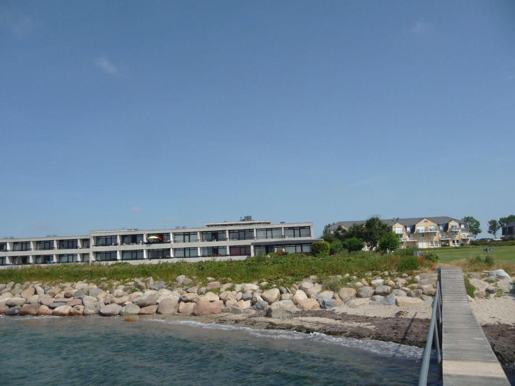 a building on the shore of a body of water at Ferienresidenz-79-5 in Staberdorf