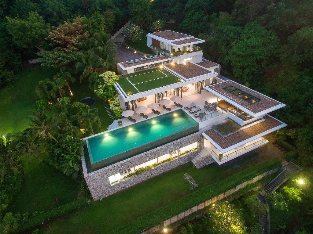 an aerial view of a mansion with a tennis court at Villa Skyfall Thailand Phuket in Panwa Beach