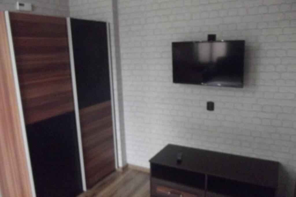 Televízia a/alebo spoločenská miestnosť v ubytovaní Nad Kamienną