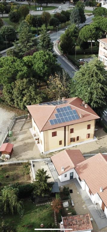 an overhead view of a building with solar panels on its roofs at Casa Bice Casa Vacanze in Case Pieve al Toppo