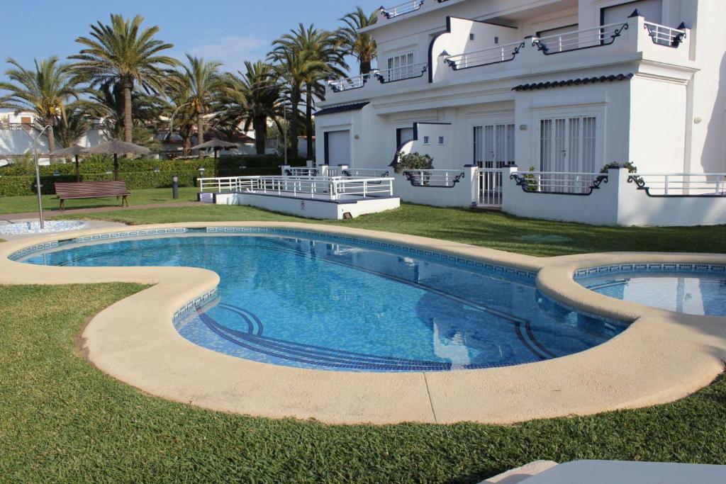 a swimming pool in front of a house at Medina Molins - Deniasol in Denia